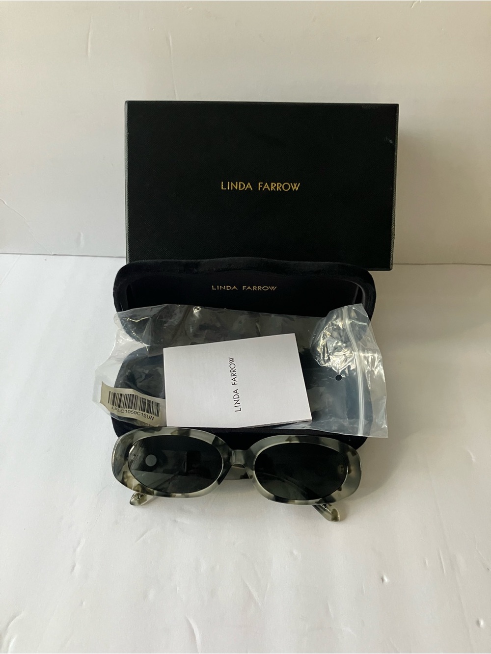 Linda Farrow Oval Marble Tortoiseshell Sunglasses with Dark Lenses